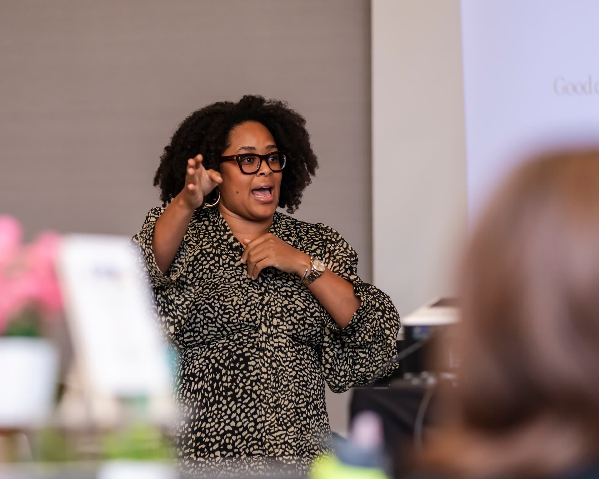 Colet Williams mid-talk, engaging the audience